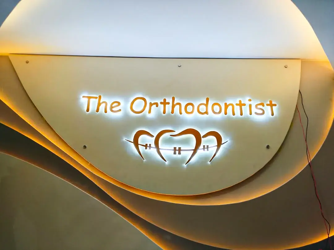 Warm illuminated interior branding created for The Orthodontist
